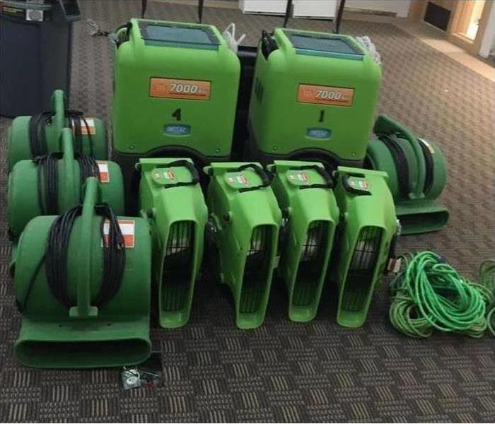 Green equipment at a job site. 